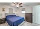 Comfortable bedroom featuring a ceiling fan, gray laminate floors, and bright natural light at 746 Cartwright Dr, Charleston, SC 29414