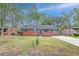 Charming brick home with a well-manicured lawn and classic architectural details, offering curb appeal and a welcoming entrance at 746 Cartwright Dr, Charleston, SC 29414