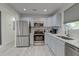 Modern kitchen with stainless steel appliances, light gray cabinets, and white backsplash at 746 Cartwright Dr, Charleston, SC 29414