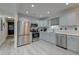 Beautiful kitchen with light gray cabinets, stainless steel appliances, and modern subway tile backsplash at 746 Cartwright Dr, Charleston, SC 29414