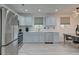 Bright kitchen with stainless steel appliances, white backsplash and light gray cabinets at 746 Cartwright Dr, Charleston, SC 29414