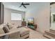 Cozy living room featuring light wood floors, comfortable seating, and a modern ceiling fan at 746 Cartwright Dr, Charleston, SC 29414