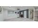 Well-lit living room with light gray walls, modern ceiling fan, and large window at 746 Cartwright Dr, Charleston, SC 29414