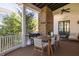 Outdoor back porch featuring a fireplace, dining area, and comfortable seating area for relaxation at 772 Post Oak Dr, Mount Pleasant, SC 29464
