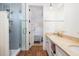 Elegant bathroom features tiled shower with glass door, dual vanity with stone countertop and white cabinets at 772 Post Oak Dr, Mount Pleasant, SC 29464