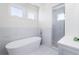 Bright bathroom with a modern free-standing tub and walk-in shower at 772 Post Oak Dr, Mount Pleasant, SC 29464