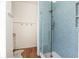 Updated bathroom featuring a glass shower with lovely scale-patterned blue tiles and a rainfall shower head at 772 Post Oak Dr, Mount Pleasant, SC 29464