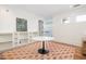 Light, airy bonus room is anchored by an area rug and built-in shelving at 772 Post Oak Dr, Mount Pleasant, SC 29464