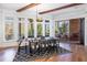 Dining area has a large window wall, access to covered porch, and hardwood floors at 772 Post Oak Dr, Mount Pleasant, SC 29464