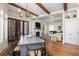 Elegant dining room with exposed wooden beams and a large dining table for entertaining at 772 Post Oak Dr, Mount Pleasant, SC 29464