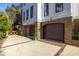 Home with two garages and a long driveway lined with brick accents and pretty shrubs and landscaping at 772 Post Oak Dr, Mount Pleasant, SC 29464