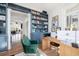 Well-organized home office with custom shelving, natural wood desk, and comfortable chair at 772 Post Oak Dr, Mount Pleasant, SC 29464