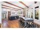 Open kitchen and dining area featuring an island with wooden beams and hardwood flooring at 772 Post Oak Dr, Mount Pleasant, SC 29464