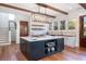Well-appointed kitchen featuring a large island, modern appliances, and wood beam accents at 772 Post Oak Dr, Mount Pleasant, SC 29464