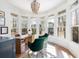 Bright and airy home office with large windows and stylish green chairs at 772 Post Oak Dr, Mount Pleasant, SC 29464