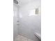 Bright shower with marble-look tile and a built-in seat at 772 Post Oak Dr, Mount Pleasant, SC 29464