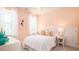 Cozy bedroom with pastel-colored walls and neutral colored bedding at 780 Clay Field Trl, Summerville, SC 29485