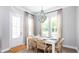 Elegant dining room with a stylish chandelier and well-appointed table setting at 780 Clay Field Trl, Summerville, SC 29485