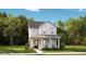 Charming two-story home with a welcoming front porch and well-manicured lawn at 780 Clay Field Trl, Summerville, SC 29485