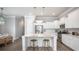 Modern kitchen features stainless steel appliances, white cabinets, and a quartz countertop island at 780 Clay Field Trl, Summerville, SC 29485