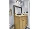Bathroom with neutral walls, an updated vanity and mirror, and tiled floors at 7940 Parklane Ct # F, North Charleston, SC 29418