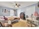 Cozy bedroom with a ceiling fan, two large closets, and hardwood floors throughout at 7940 Parklane Ct # F, North Charleston, SC 29418