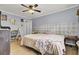 Spacious bedroom featuring natural light, hardwood floors, a ceiling fan, and ample closet space at 7940 Parklane Ct # F, North Charleston, SC 29418