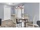 Dining area featuring a round wood table and chairs with access to the porch at 7940 Parklane Ct # F, North Charleston, SC 29418