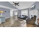 Bright living room with hard wood floors, fireplace, large windows and an open floor plan at 7940 Parklane Ct # F, North Charleston, SC 29418