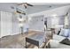 Bright open living room featuring vaulted ceilings, hardwood floors, and an open floor plan at 7940 Parklane Ct # F, North Charleston, SC 29418