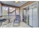 Relaxing screened porch with comfortable seating, a grill, and sliding door access to the indoors at 7940 Parklane Ct # F, North Charleston, SC 29418