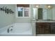 Spacious bathroom features a soaking tub, granite countertop, and double sinks at 835 Hale St, Charleston, SC 29412
