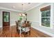 Bright dining room features a wooden table with seating for six and views of the landscaped backyard at 835 Hale St, Charleston, SC 29412