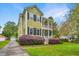 Beautiful two-story home featuring double porches, manicured landscaping and a driveway at 835 Hale St, Charleston, SC 29412