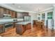 Open kitchen with stainless steel appliances, granite countertops, and an eat-in area for casual dining at 835 Hale St, Charleston, SC 29412