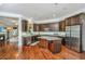 Gourmet kitchen with stainless steel appliances, granite countertops, kitchen island, and open floor plan to living spaces at 835 Hale St, Charleston, SC 29412