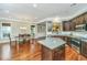 Modern kitchen with granite countertops, stainless steel appliances, and views of an adjoining dining area at 835 Hale St, Charleston, SC 29412