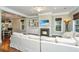 Inviting living area with hardwood floors, fireplace, built-in shelving and dining area beyond at 835 Hale St, Charleston, SC 29412