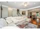 Open-concept living room with hardwood floors, a plush sectional, and seamless flow to dining at 835 Hale St, Charleston, SC 29412