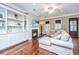 Cozy living room boasts built-in shelving, fireplace, and hardwood floors, creating a warm ambiance at 835 Hale St, Charleston, SC 29412