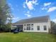 Backyard with screened-in porch and outdoor seating area at 9411 Harroway Rd, Summerville, SC 29485
