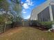 Fully fenced backyard, featuring lush green grass, mature trees, and a tranquil retreat for outdoor enjoyment at 9411 Harroway Rd, Summerville, SC 29485