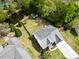 Aerial view of the house with a lush backyard with pond and small storage shed at 9411 Harroway Rd, Summerville, SC 29485