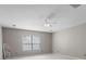 A spacious bedroom with a ceiling fan and a window with blinds at 9411 Harroway Rd, Summerville, SC 29485
