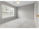 Bedroom with large window for natural light and neutral walls and ceiling fan at 9411 Harroway Rd, Summerville, SC 29485