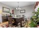 Elegant dining room with a modern table, bench seating, and stylish decor at 9411 Harroway Rd, Summerville, SC 29485
