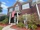 Two-story brick home with manicured lawn at 9411 Harroway Rd, Summerville, SC 29485