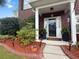 Entrance with black planters and decorative lighting at 9411 Harroway Rd, Summerville, SC 29485