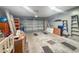 Spacious garage with ample storage space and a roll-up door, ready for your vehicles and projects at 9411 Harroway Rd, Summerville, SC 29485