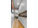 Hallway with white cabinets and decorative candles that leads into the dining area at 9411 Harroway Rd, Summerville, SC 29485